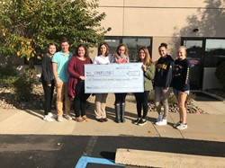 Members of Coughlin's Key Club present at check to Candy's Place. 